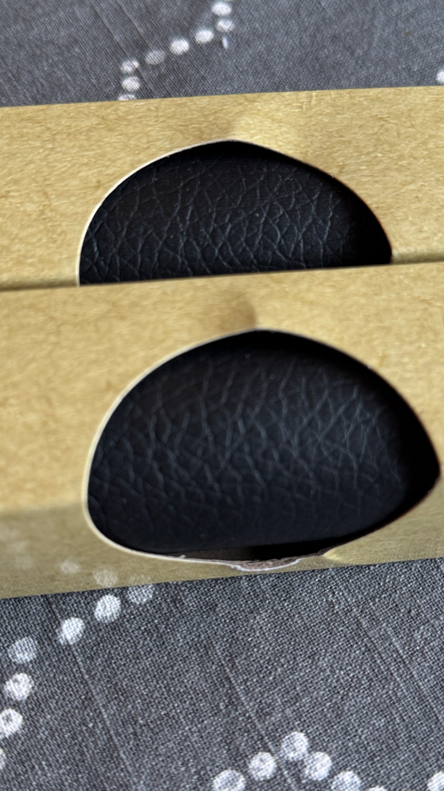 Close-up black faux leather texture showing material quality