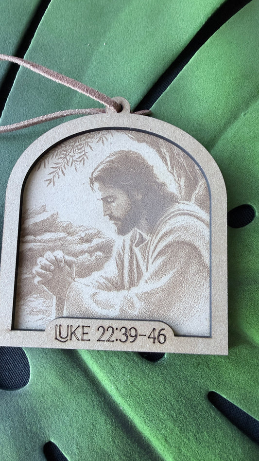 Close-up of Jesus in Prayer ornament showing handcrafted detail and premium quality, Christian Christmas decoration with inspirational story card"