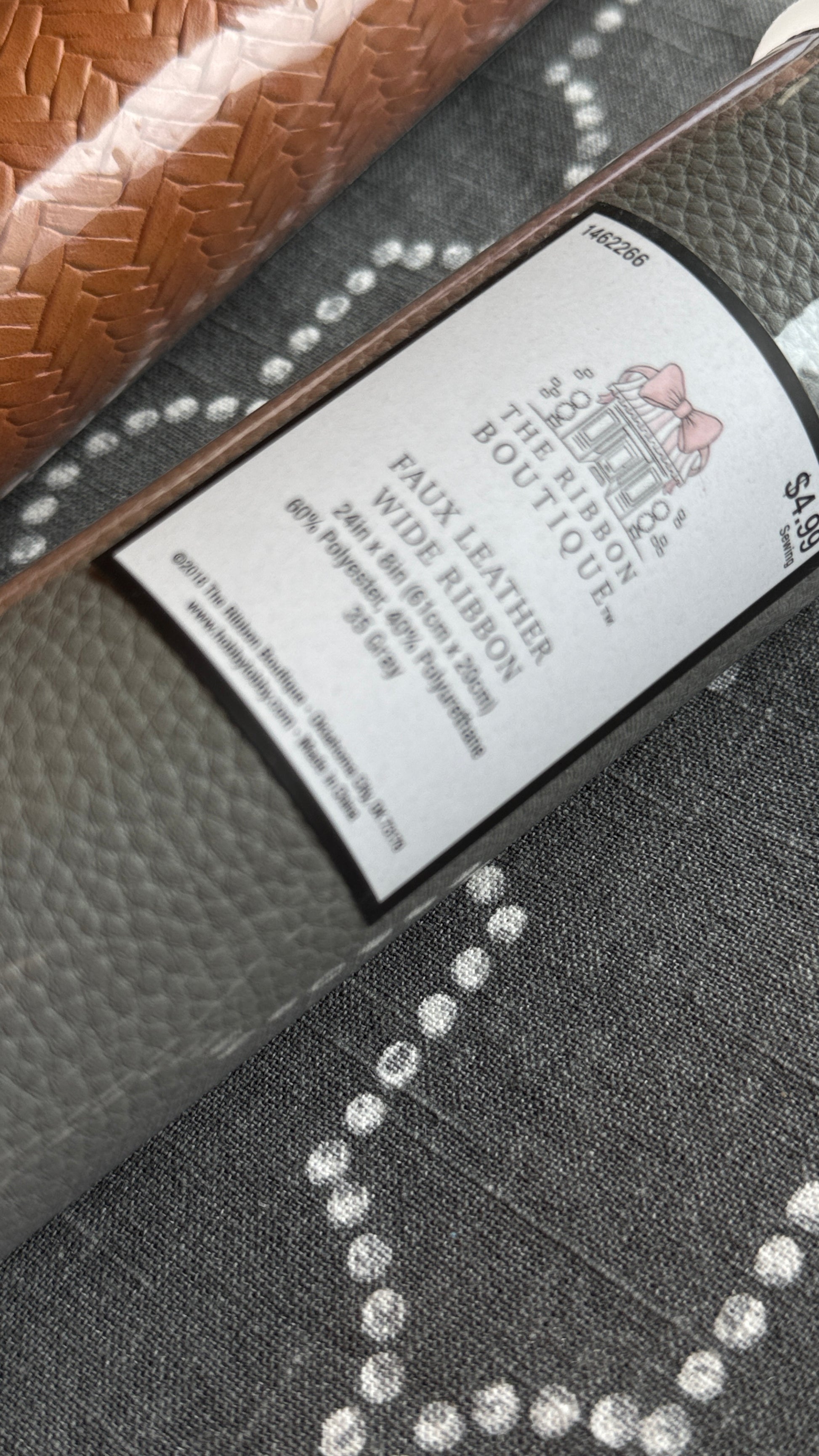 Gray faux leather ribbon close-up texture