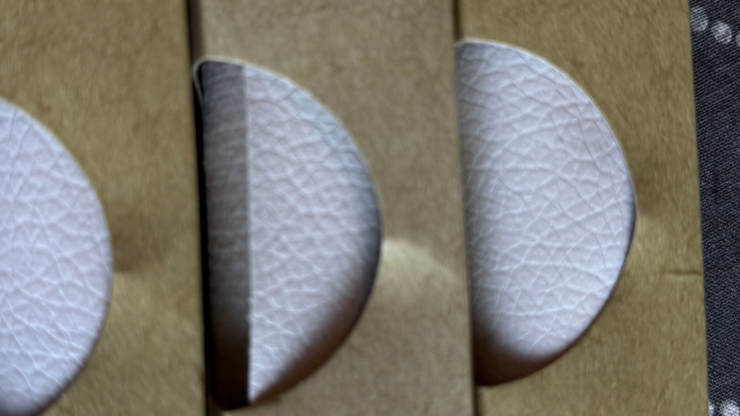 Close-up white faux leather texture and material detail