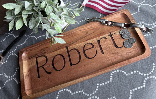 Robert engraved wood tray staged with plant to bring out wood tones