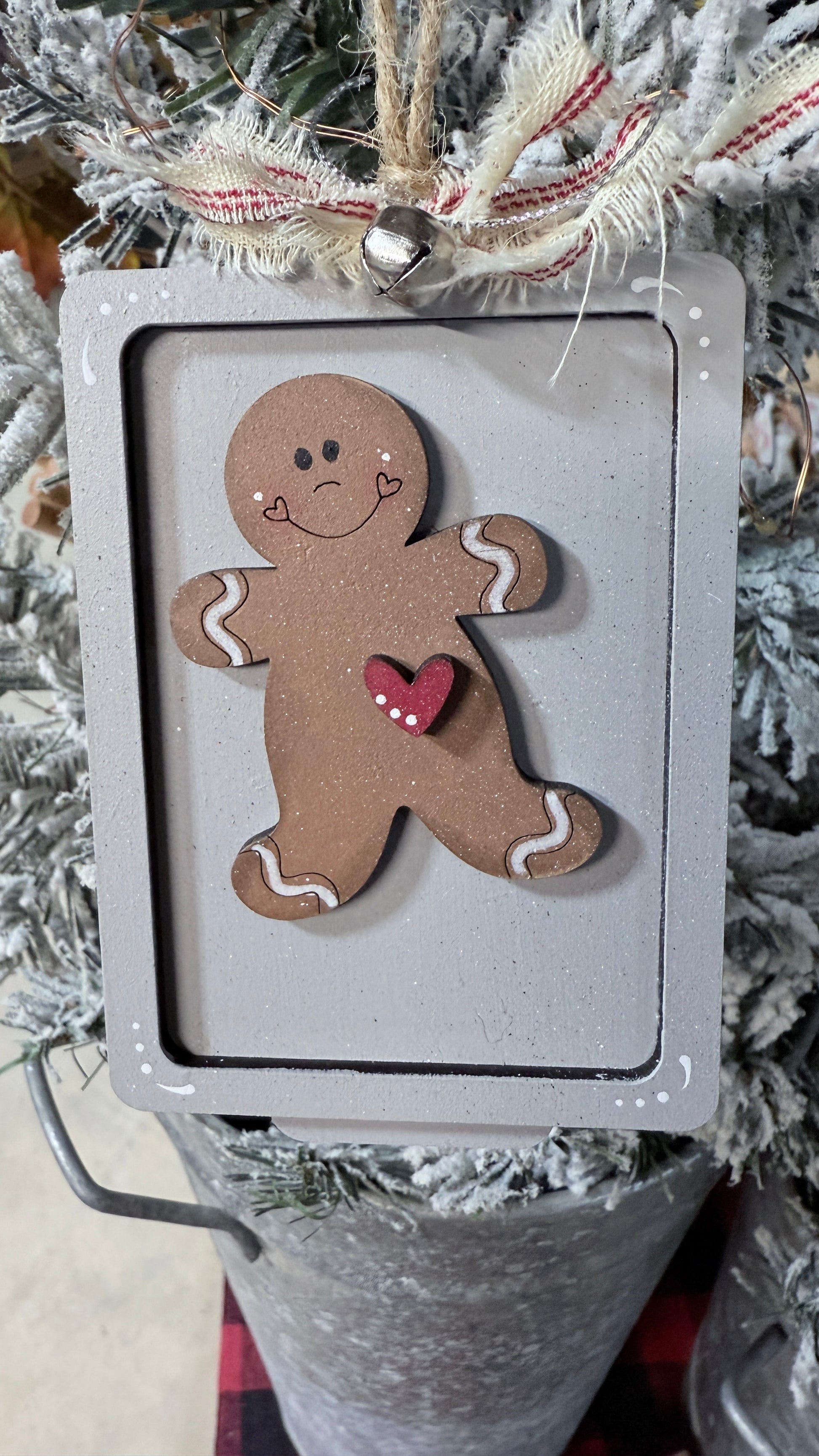 Decorative gingerbread man ornament on a Christmas tree