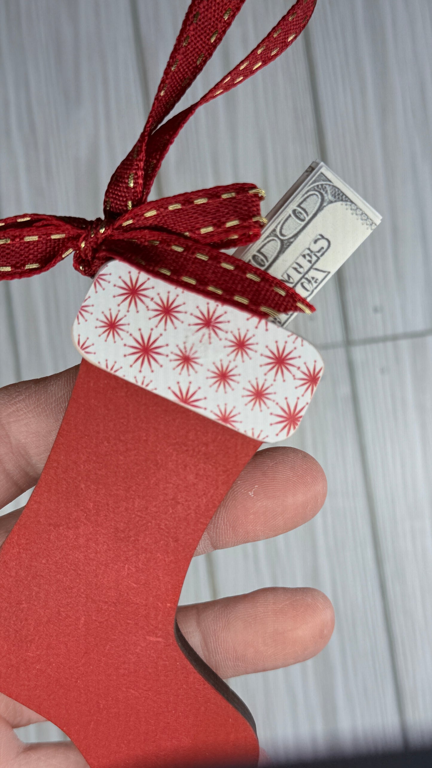 Red Stocking with a nostalgic pattern cuff. This ornament is perfect for gifting a little holiday CASH.  Cash not included. 