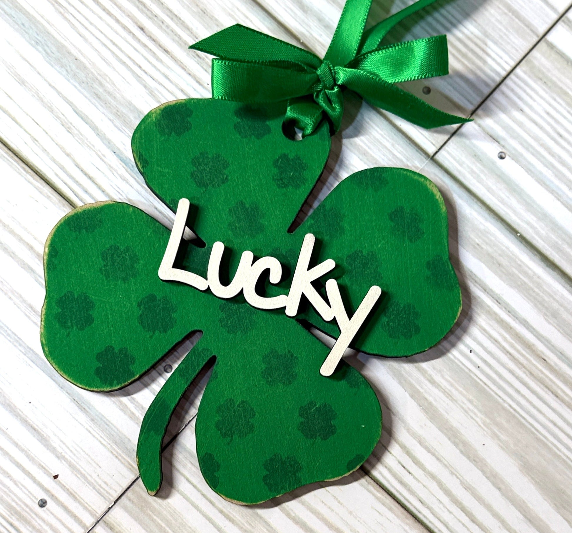 Shamrock stencil on a 4 leaf clover (dark green on spring green) and says Lucky in cream DesignsBySNK  digital file 
