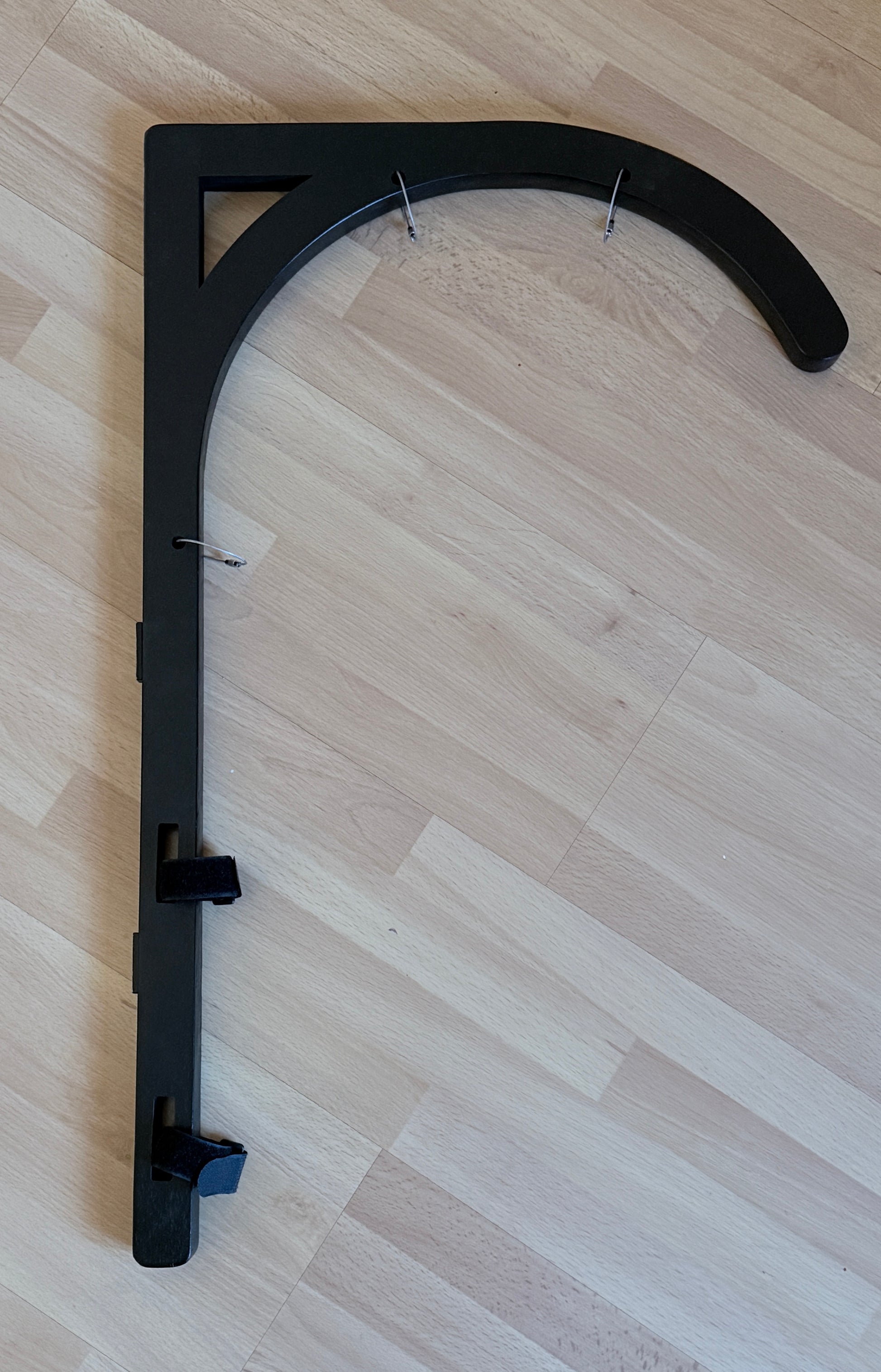 "Wooden tent bracket in black finish showing included hardware - magnets, Velcro straps and cable connectors"
